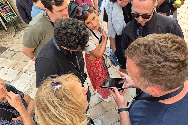 Team strategizing during Zadar Tablet GPS Quest challenge